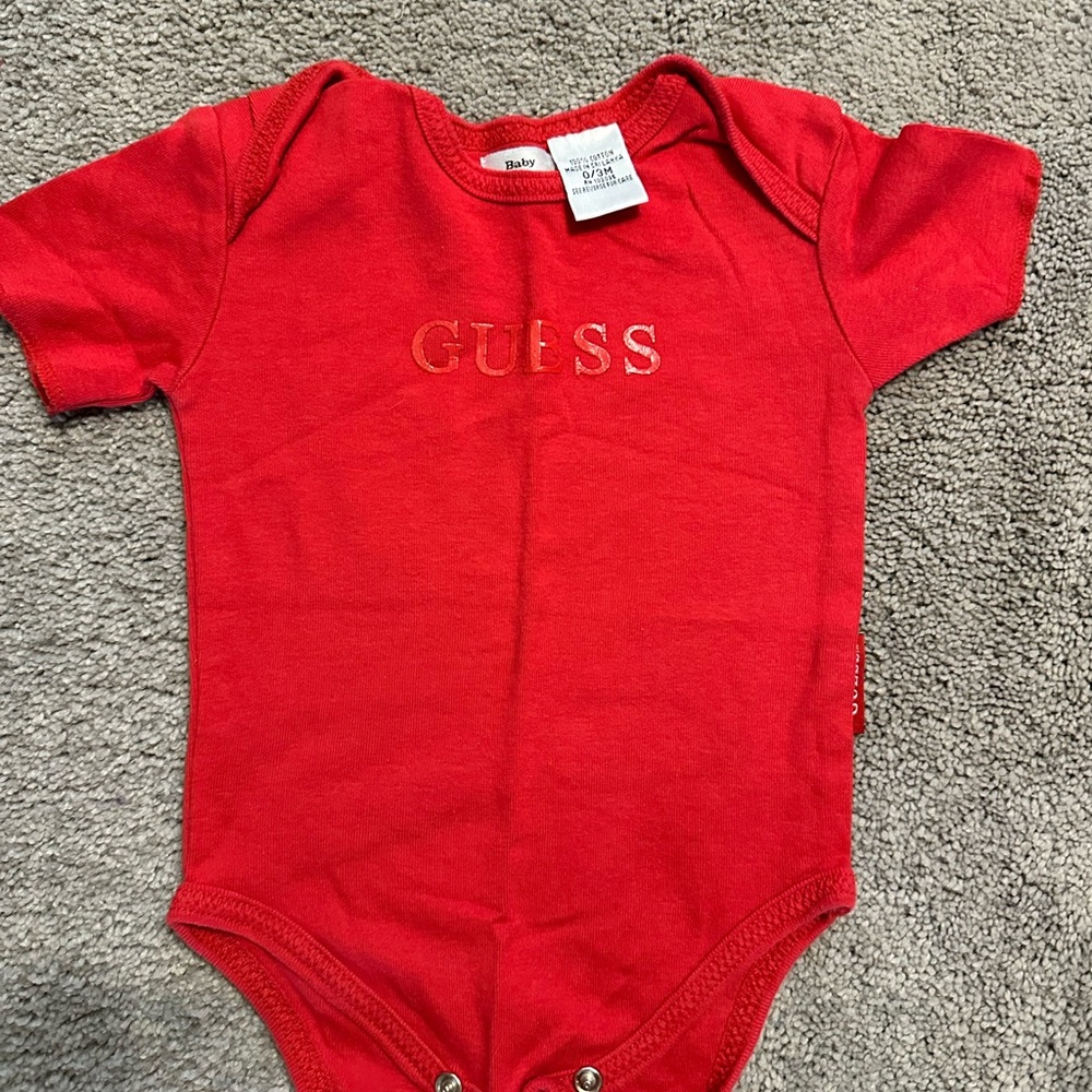 Guess onesie. Size 0-3 months Red  snap crotch name Guess printed on front
